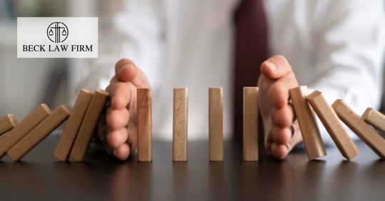 Businessman Stops Domino Effect. Risk Management and Insurance Concept